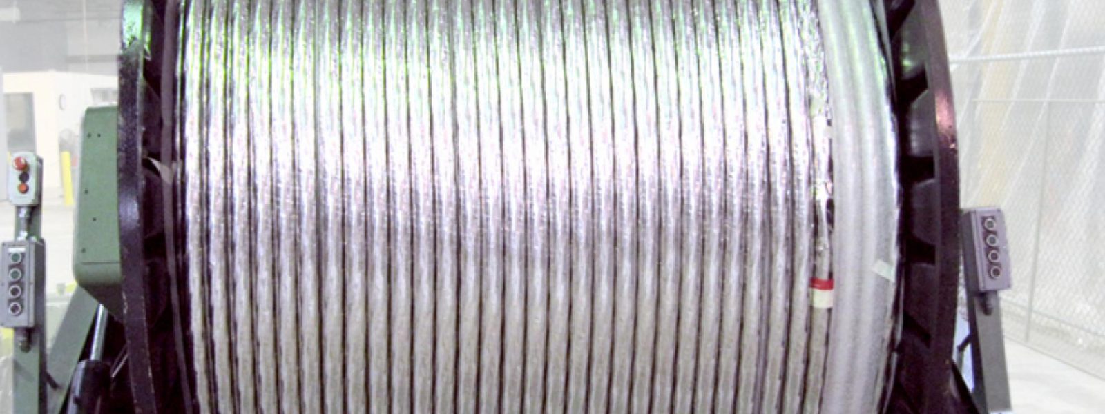 Superconducting strand is cabled at New England Wire Technologies on 2.5 meter wide by 2 meter tall spools before shipment to Florida for conductor jacketing.