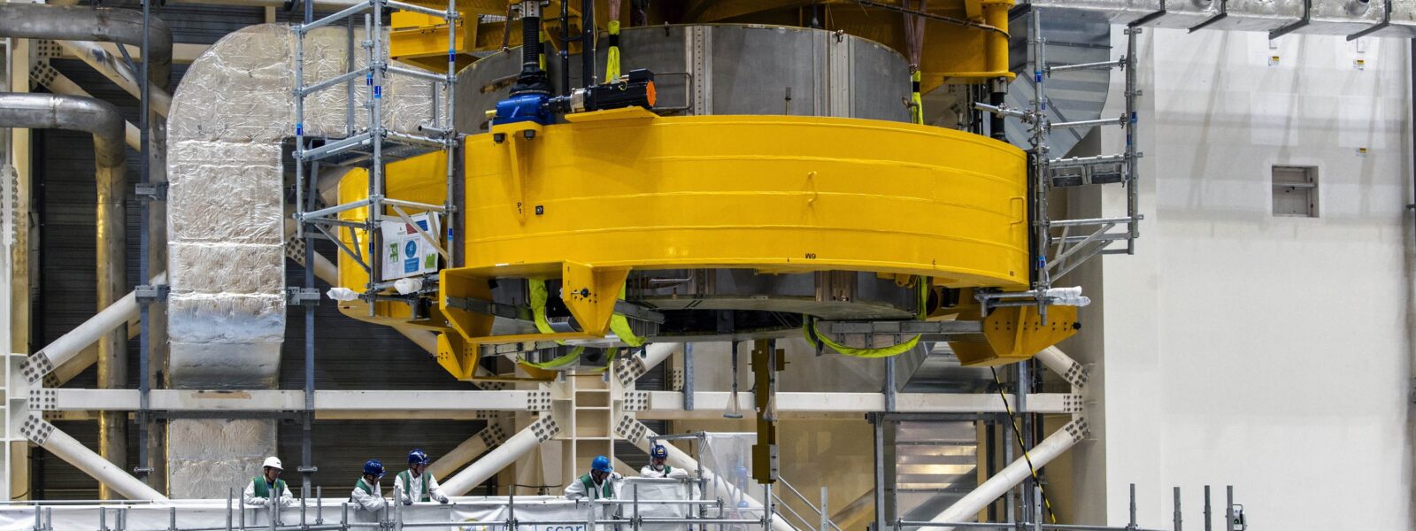 Third central solenoid module being lowered on to the stack