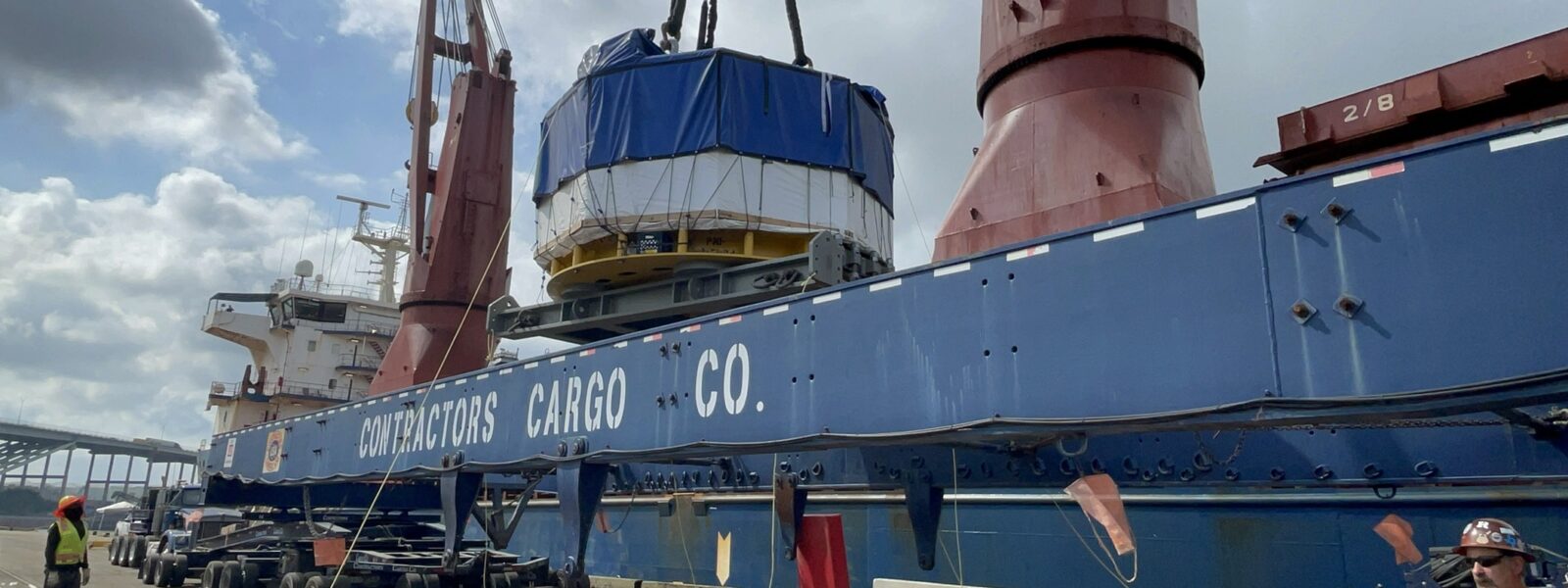 central solenoid module being placed on a barge