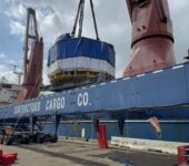 central solenoid module being placed on a barge