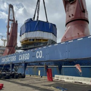 central solenoid module being placed on a barge