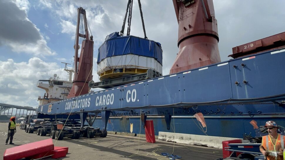 central solenoid module being placed on a barge