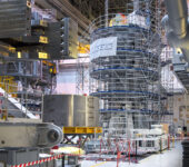 The fifth module, shown at the left of the central solenoid stack, arrived at the ITER site earlier this year, and the sixth module has just arrived in France from the United States. Photo: ITER Organization